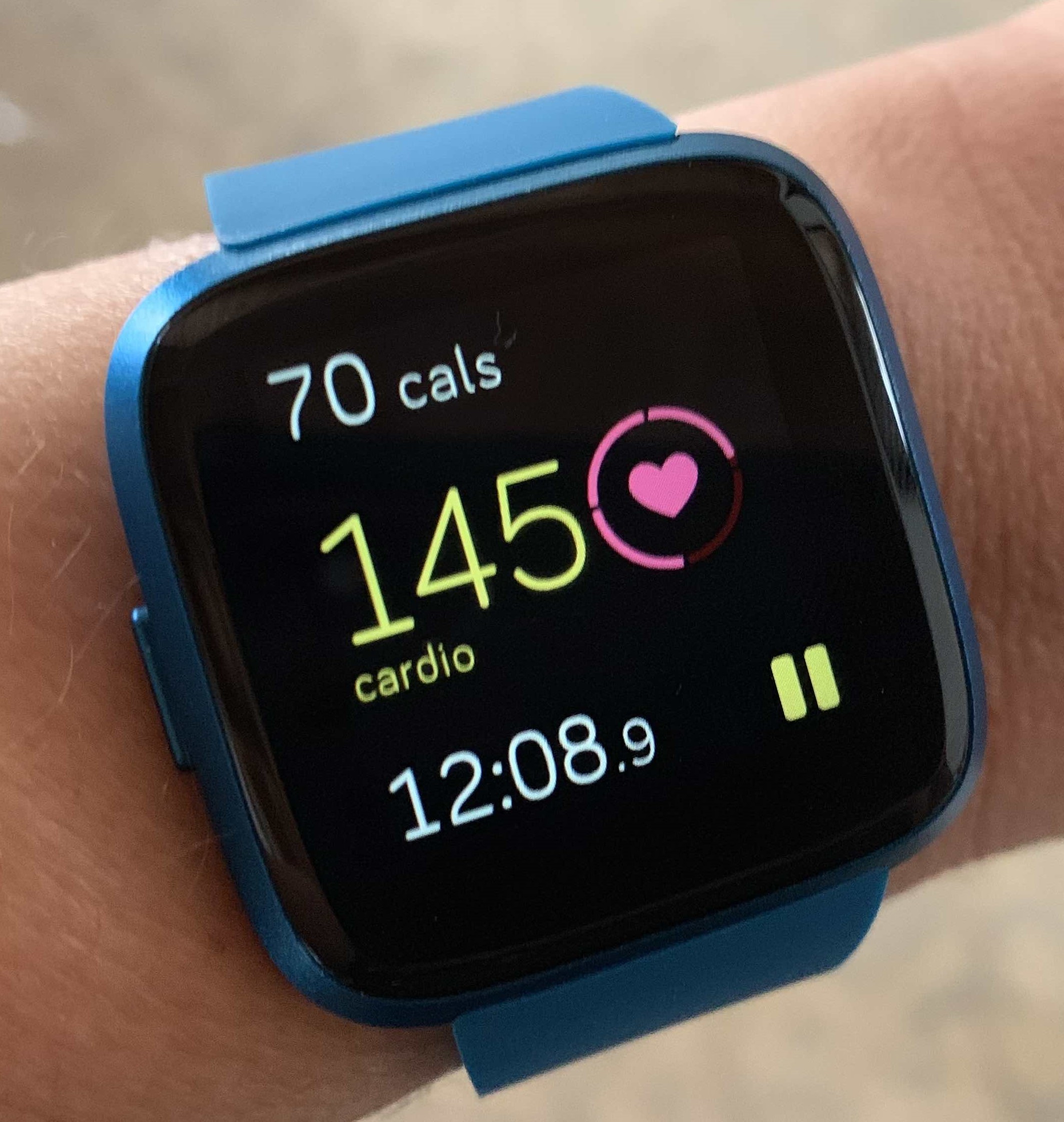 A person's heartrate being measured on their Fitbit Watch